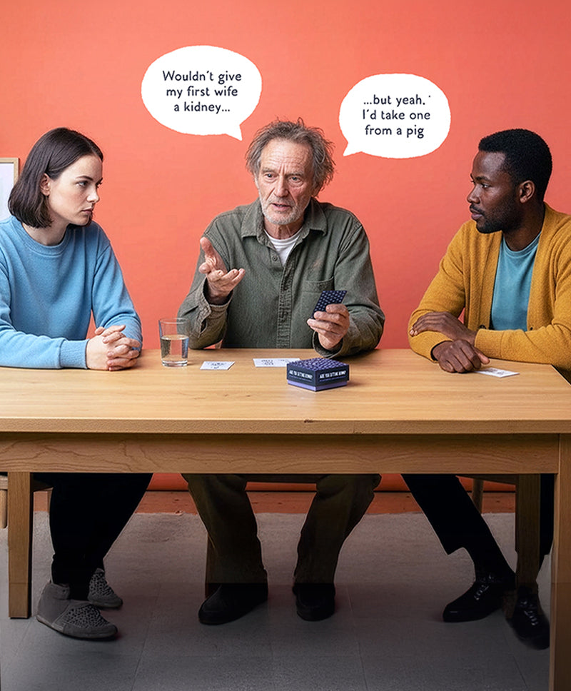Three people sitting around a table playing Are You Sitting Down? conversation card game, showcasing the unique artwork and thought-provoking questions